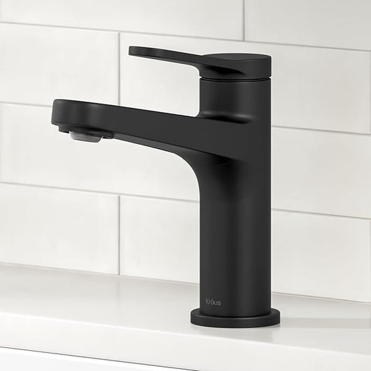 Black faucet on a white tiled wall background