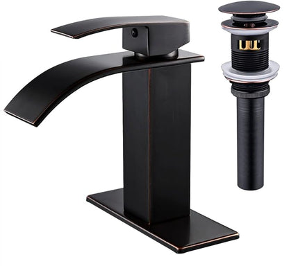 Black bathroom faucet with drain assembly on a white background
