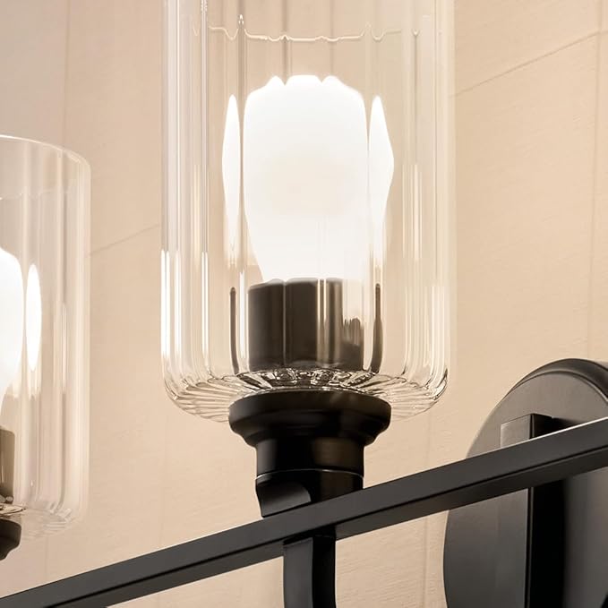 Kichler Gioe 24.25" 3-Light Vanity Light with Clear Fluted Glass in Black, Damp Rated, for Bathroom, Powder Room, Over a Mirror, (24.25" W x 10.5" H), 55226BKFLU