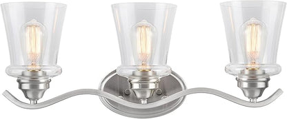 Aspen Creative 62117-1, Three-Light Metal Bathroom Vanity Wall Light Fixture, 24" Wide, Transitional Design in Satin Nickel with Clear Glass Shade