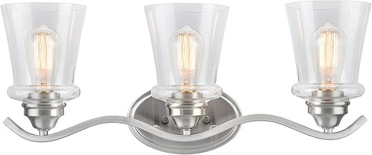 Aspen Creative 62117-1, Three-Light Metal Bathroom Vanity Wall Light Fixture, 24" Wide, Transitional Design in Satin Nickel with Clear Glass Shade