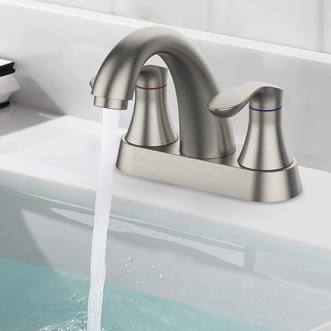 Stainless steel faucet with water flowing into a bathtub