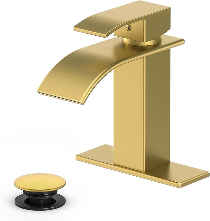 Gold faucet with a black drain handle on a white background