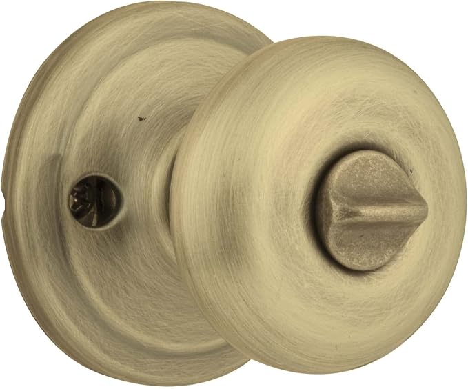 Kwikset Juno Interior Passage Door Knob, Handle For Closet and Hallway Doors, Non-Locking Doorknob in Antique Brass, with Microban Protection