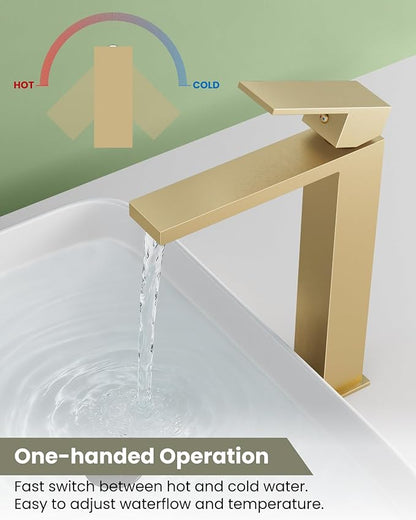 Gold faucet with water flowing into a sink, labeled for hot and cold water.