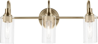 Kichler Kavi 23" 3-Light Vanity Light with Clear Glass in Champagne Bronze, Damp Rated, for Bathroom, Powder Room, Over a Mirror, (23" W x 10" H), 55211CPZ