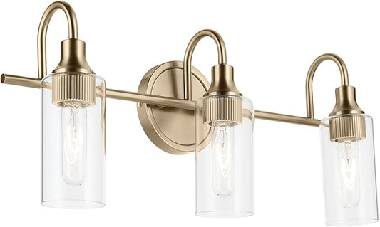 Kichler Kavi 23" 3-Light Vanity Light with Clear Glass in Champagne Bronze, Damp Rated, for Bathroom, Powder Room, Over a Mirror, (23" W x 10" H), 55211CPZ