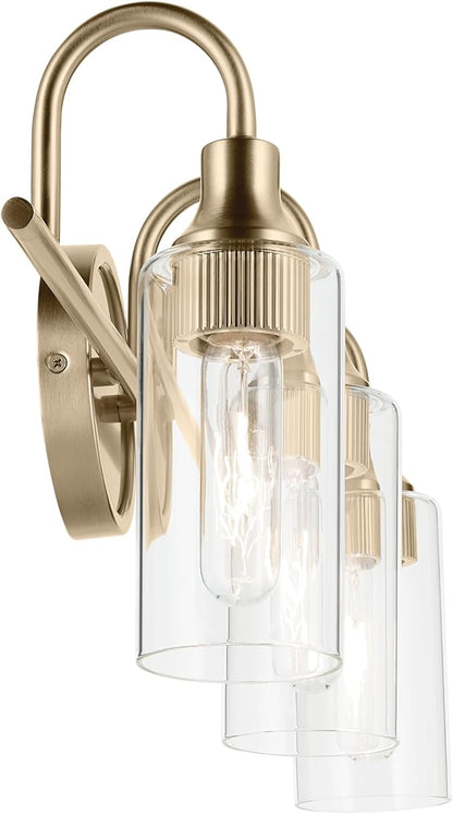 Kichler Kavi 23" 3-Light Vanity Light with Clear Glass in Champagne Bronze, Damp Rated, for Bathroom, Powder Room, Over a Mirror, (23" W x 10" H), 55211CPZ