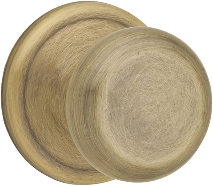 Kwikset Juno Interior Passage Door Knob, Handle For Closet and Hallway Doors, Non-Locking Doorknob in Antique Brass, with Microban Protection
