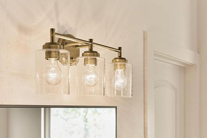 Kichler Winslow 21.5" 3-Light Vanity Light with Clear Seeded Glass in Natural Brass for Vanity, Luxe Industrial, (21.5" x 9.25"), 45886NBR