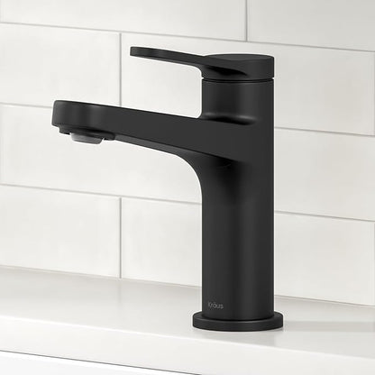 Black faucet on a white tiled wall background