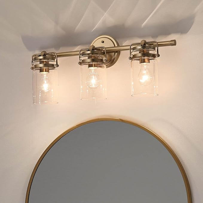 Kichler, Brinley 24" 3 Light Vanity Light with Clear Glass in Champagne Bronze for Bathroom and Powder Room, (24" W x 10.25" H), 45689CPZ