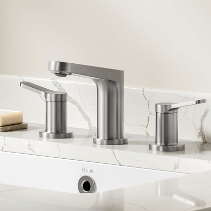 Modern silver faucet set on a marble countertop with a neutral background