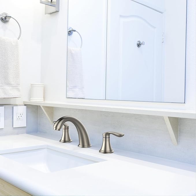 Bathroom sink with faucet and white cabinets
