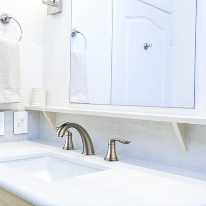 Bathroom sink with faucet and white cabinets