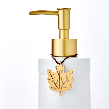 SKL Home Seasonal Charm Soap/Lotion Dispenser & 4 Holiday Charms, Warm Gold | Interchangeable designs to celebrate all year! Gift-ready & great for the bathroom, kitchen, bar or any sink space.