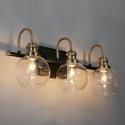 KSANA Black Gold Vanity Light, Modern 3-Light Bathroom Light Fixture with Clear Glass Globes, Electroplating Brass 22”L Vanity Lighting Over Mirror