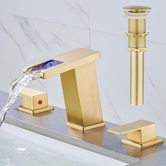 Gold faucet set with water flowing on a white background