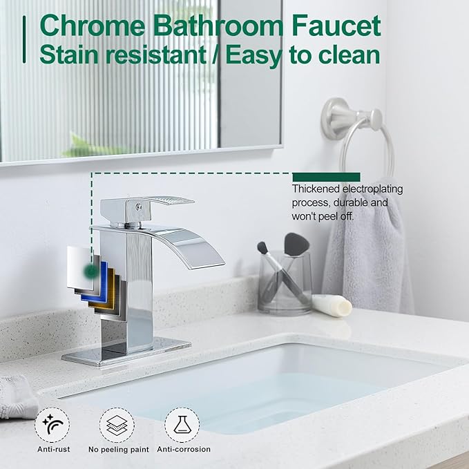 Chrome bathroom faucet with sink and mirror in the background