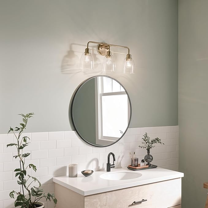 Kichler Meller 24.25 Inch 3 Light Vanity Light with Clear Glass Shades in Champagne Bronze for Bathroom or Powder Room, (24.25" W x 11.25" H x 7" D) 55102CPZ