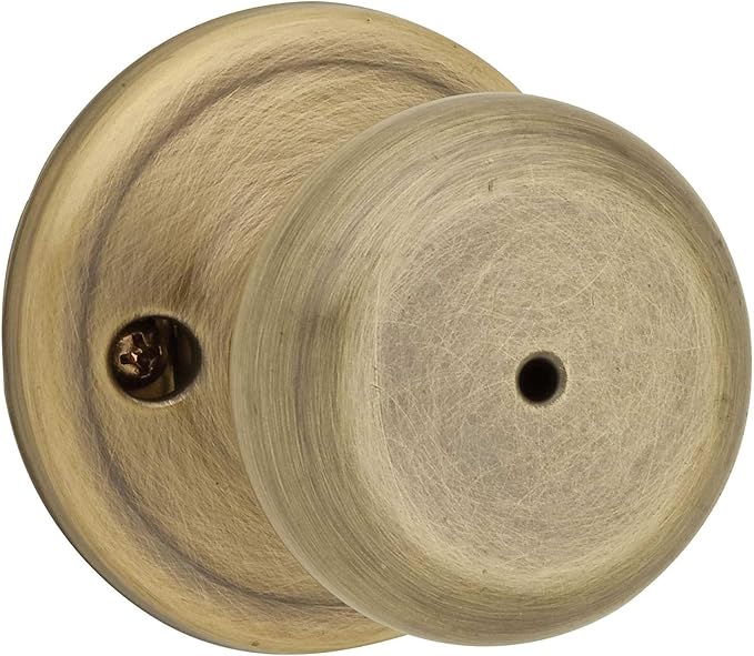 Kwikset Juno Interior Passage Door Knob, Handle For Closet and Hallway Doors, Non-Locking Doorknob in Antique Brass, with Microban Protection