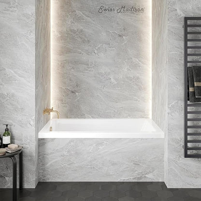 Bathroom with a white bathtub against gray tiled walls, featuring Swiss Madison branding.