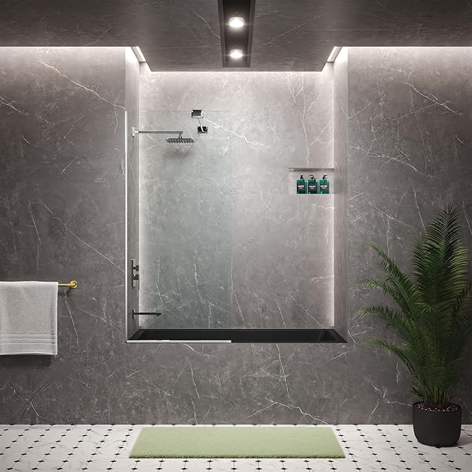 Modern bathroom with a shower enclosure, towel, bath mat, and plant.