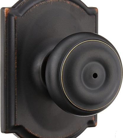 Schlage F40 GEO 716 CAM Georgian Door Knob with Camelot Trim, Bed & Bath Privacy Lock, Aged Bronze