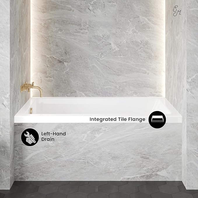 Bathroom with a white bathtub against a gray tiled wall, featuring text labels for 'Integrated Tile Flange' and 'Left-Hand Drain'.