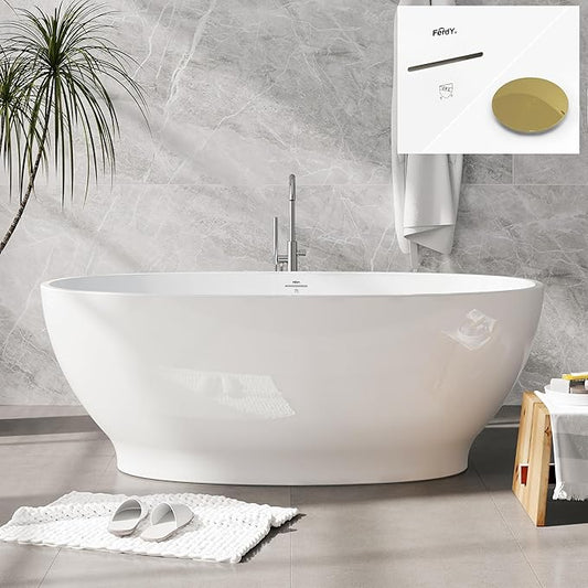 White freestanding bathtub in a modern bathroom with a gray tiled wall and a plant.