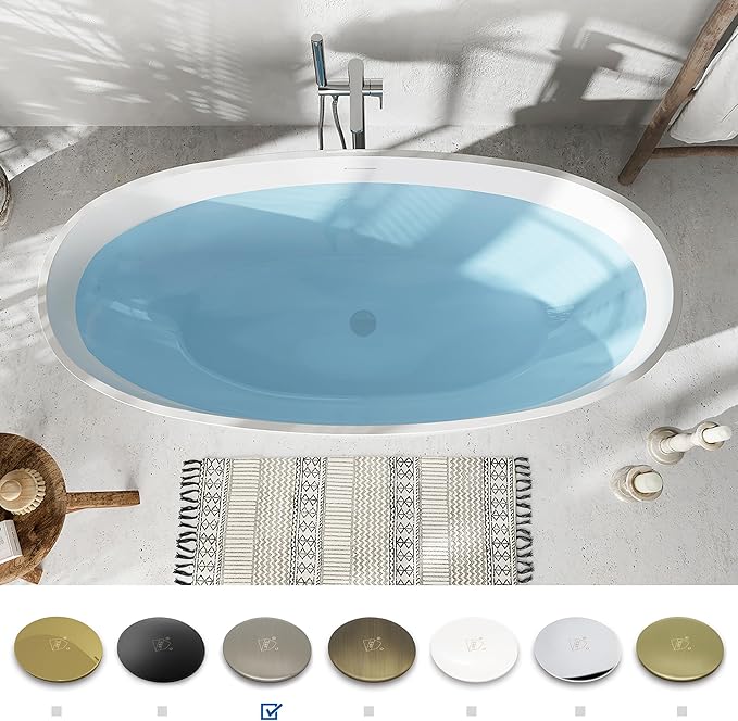 Modern oval bathtub with a towel and decorative items in a bathroom setting