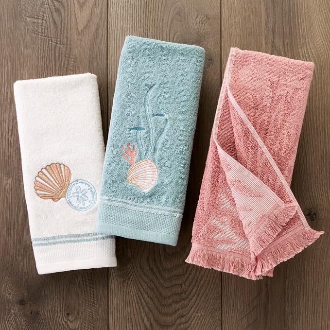 SKL Home Ocean Coral Sculpted Hand Towel Set-2pc, 100% Cotton, Coral | Soft & absorbent with fringed hem. For use in the bathroom, kitchen, or bar. Great for Airbnb, beach homes & coastal décor.